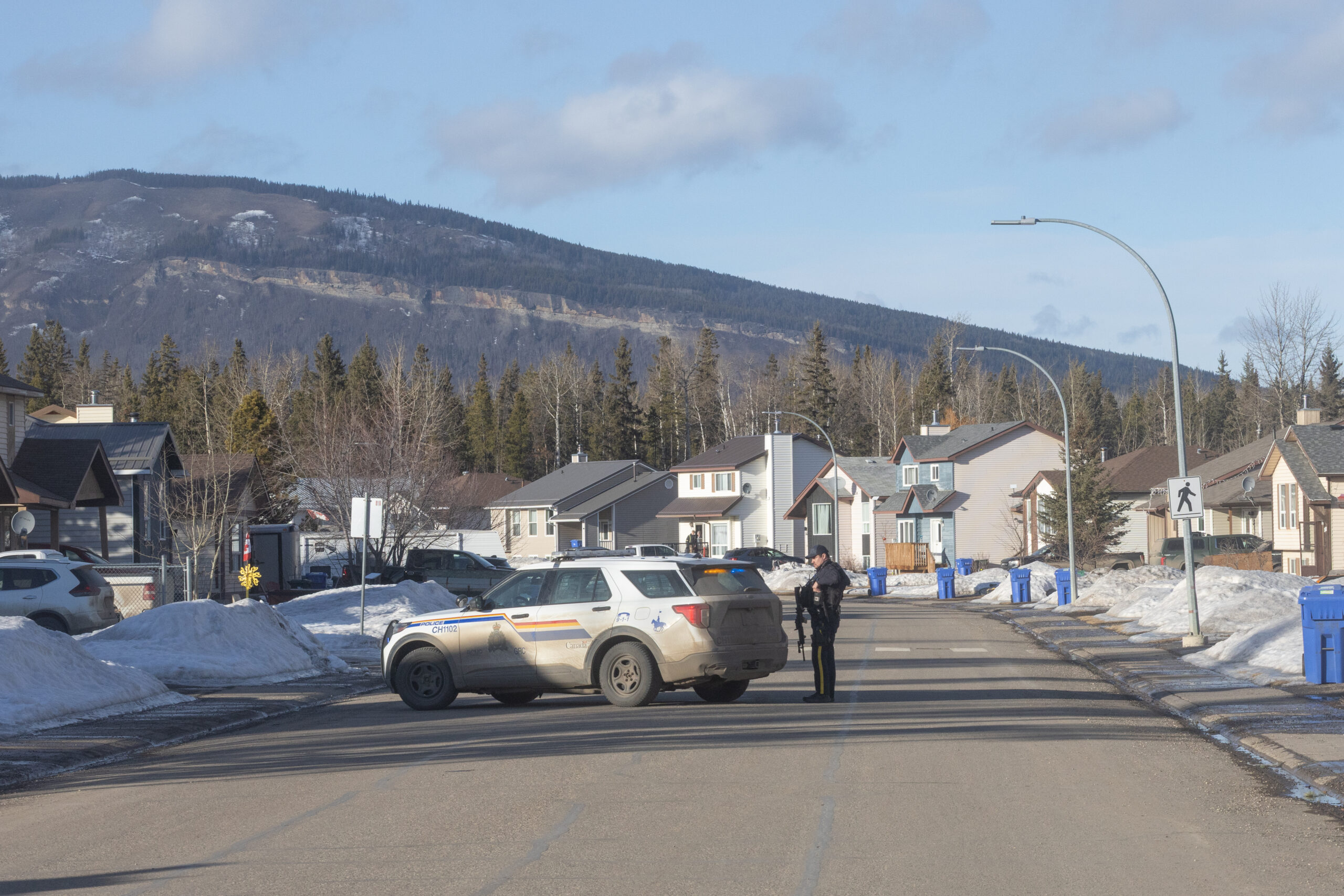 RCMP in front of house on Fellers where two people were found dead.